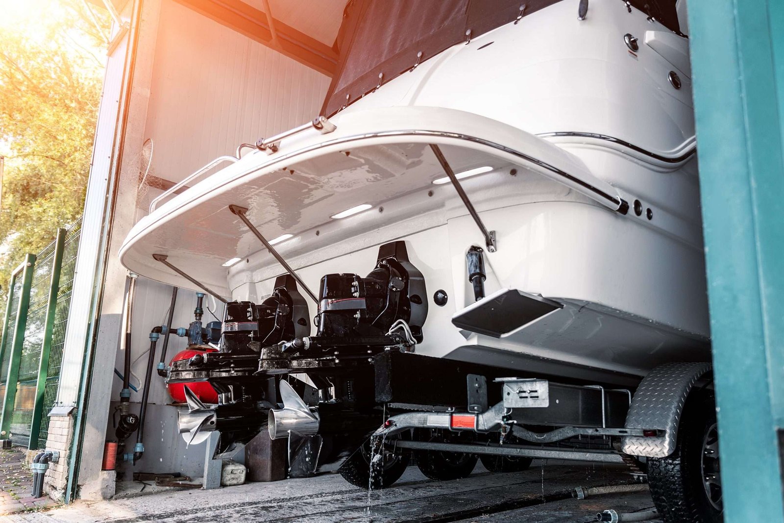 Tail end of a big boat / yacht in storage garage.