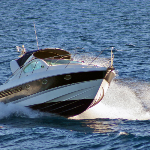Picture of ski boat on water with high wake