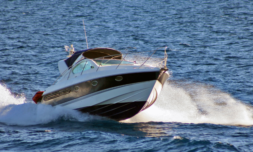 Picture of ski boat on water with high wake